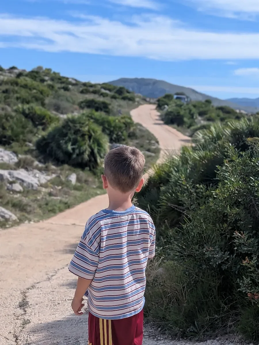 A child walking along a countryside path