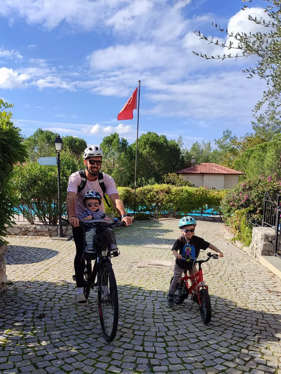 Joe enjoying a bike ride with his two sons